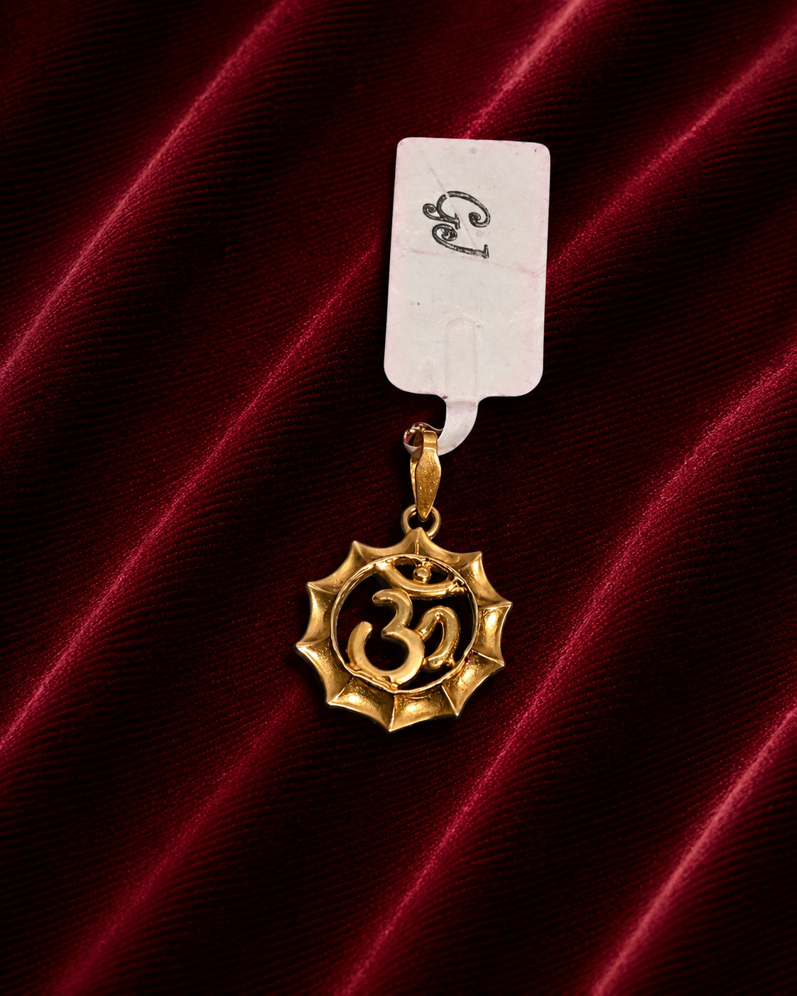 Gold hallmark murti locket 